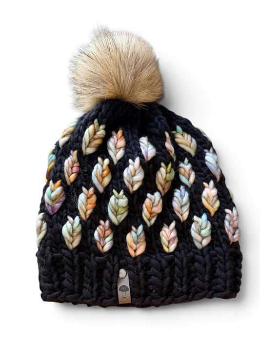 A New Leaf Knit Beanie, Super Bulky, Pale Rainbow on Black with Pom